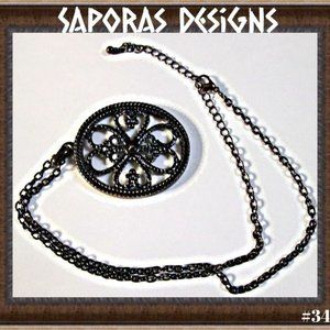 Antique Bronze In Color Sleeping Beauty Pin Wheel Design Necklace